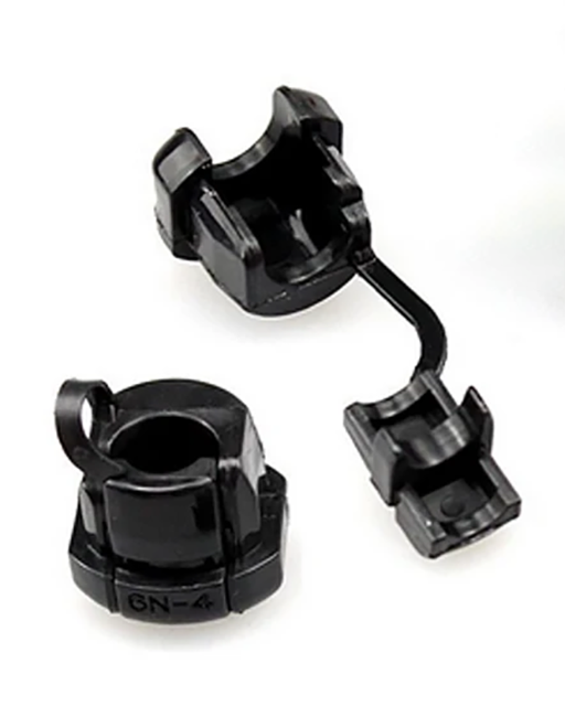 A snap-in strain-relief cable grommet that clamps the cord in the hole.